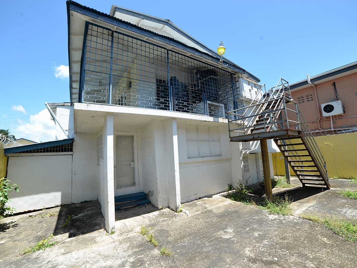 Cornerstone™ Property on Sellier Street Cornerstone- Modern house with glass balcony and external staircase in Curepe.