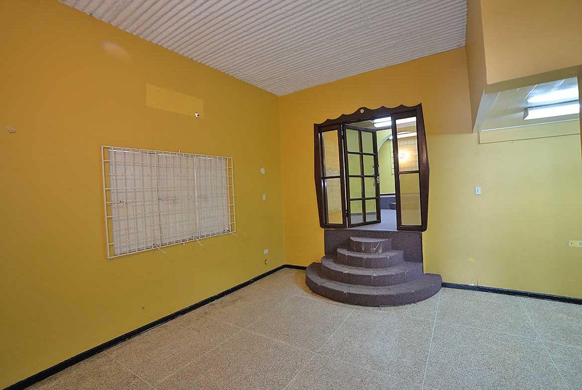 Cornerstone- Interior of Cornerstone™ property with yellow walls and staircase.