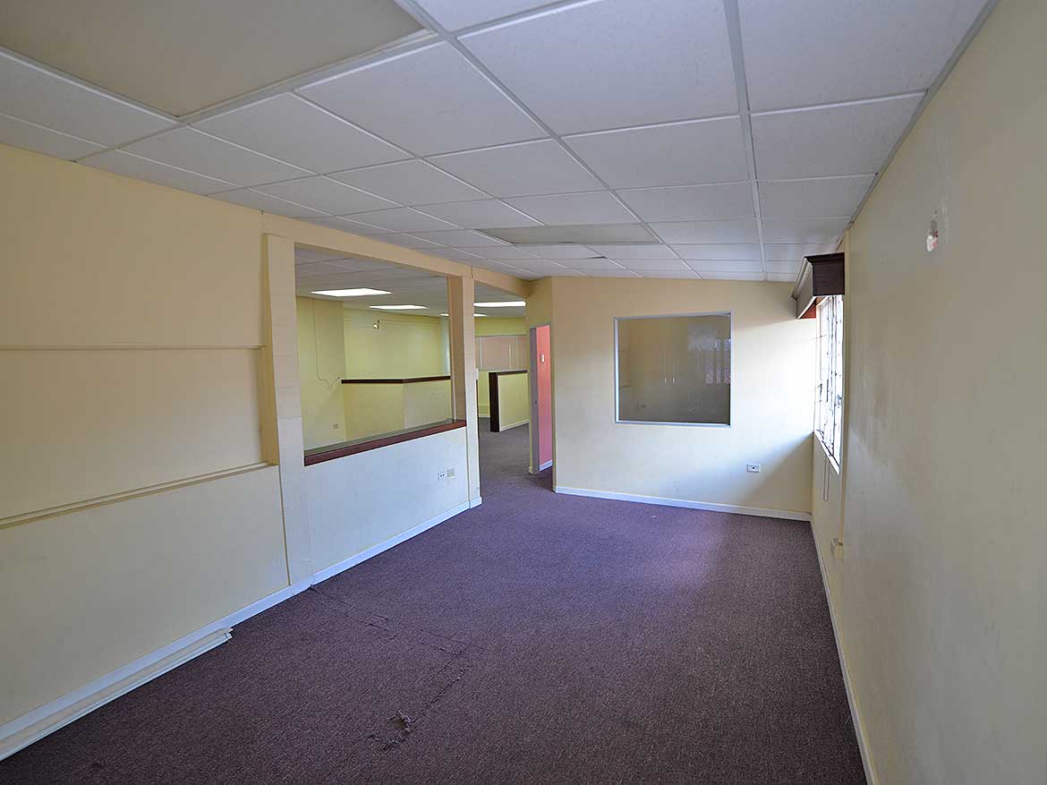 Interior of Commercial Space on Sellier Street Cornerstone- Spacious empty room in commercial property on Sellier Street, Curepe.