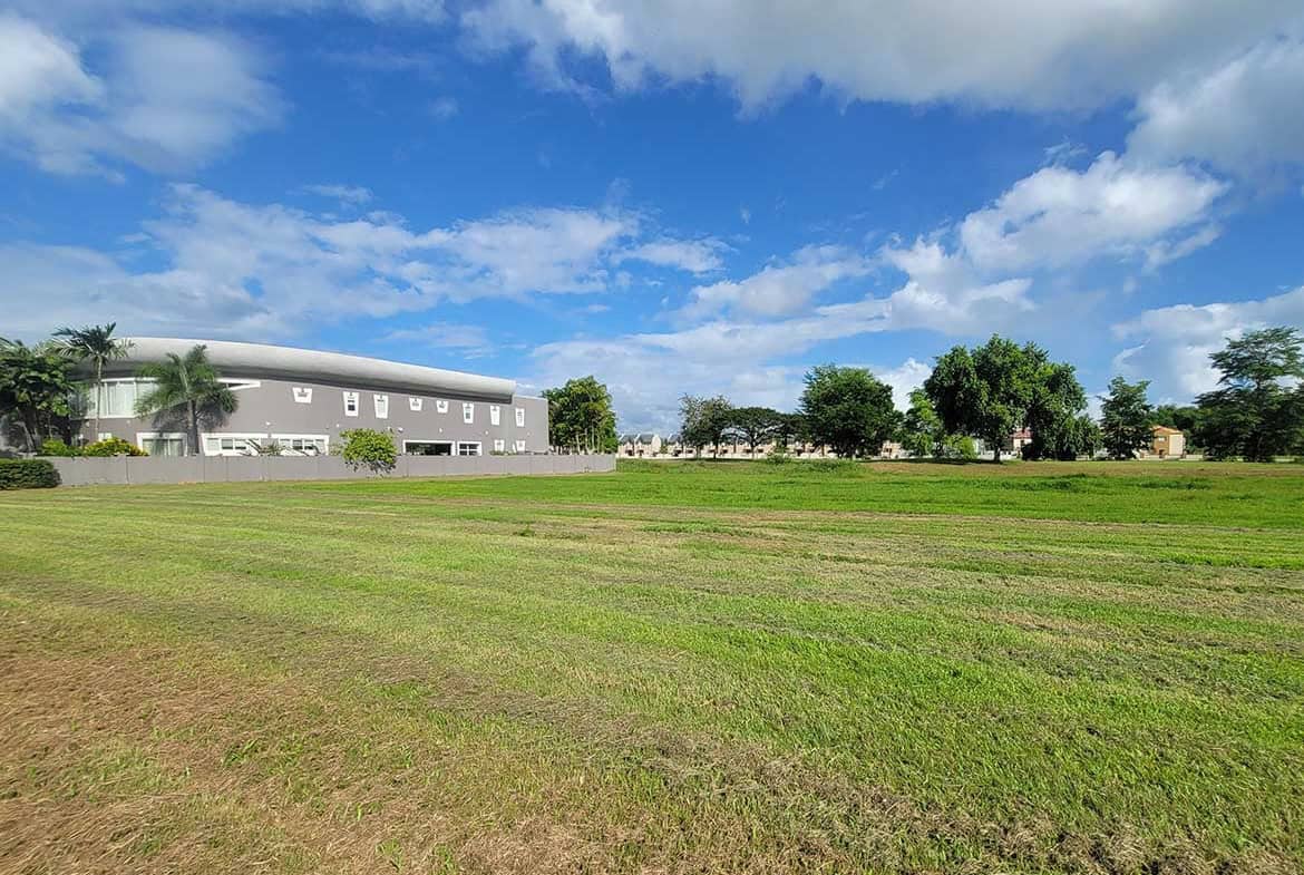 Cornerstone- Open field with new villas and blue sky at Millennium Lakes.