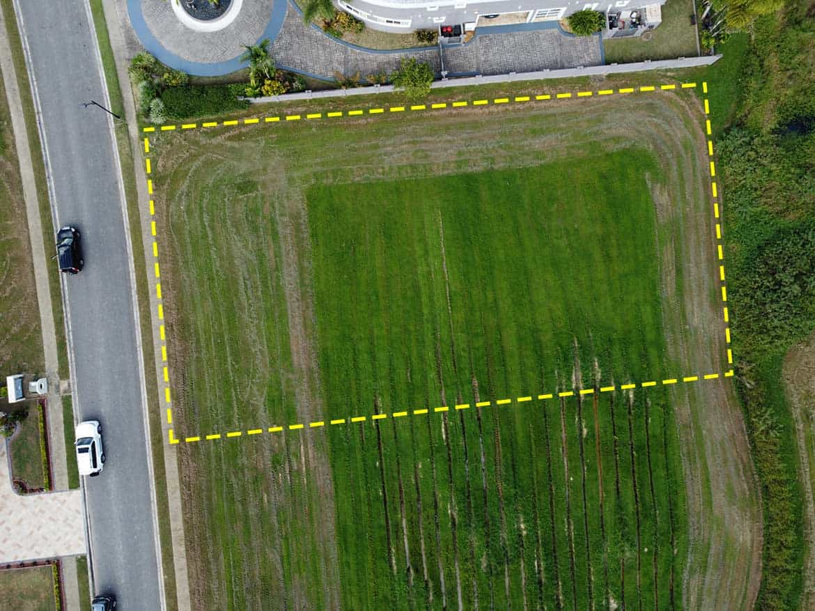 Villas at Millennium Lakes Lot Cornerstone- Vacant lot at Villas at Millennium Lakes for development or landscaping.