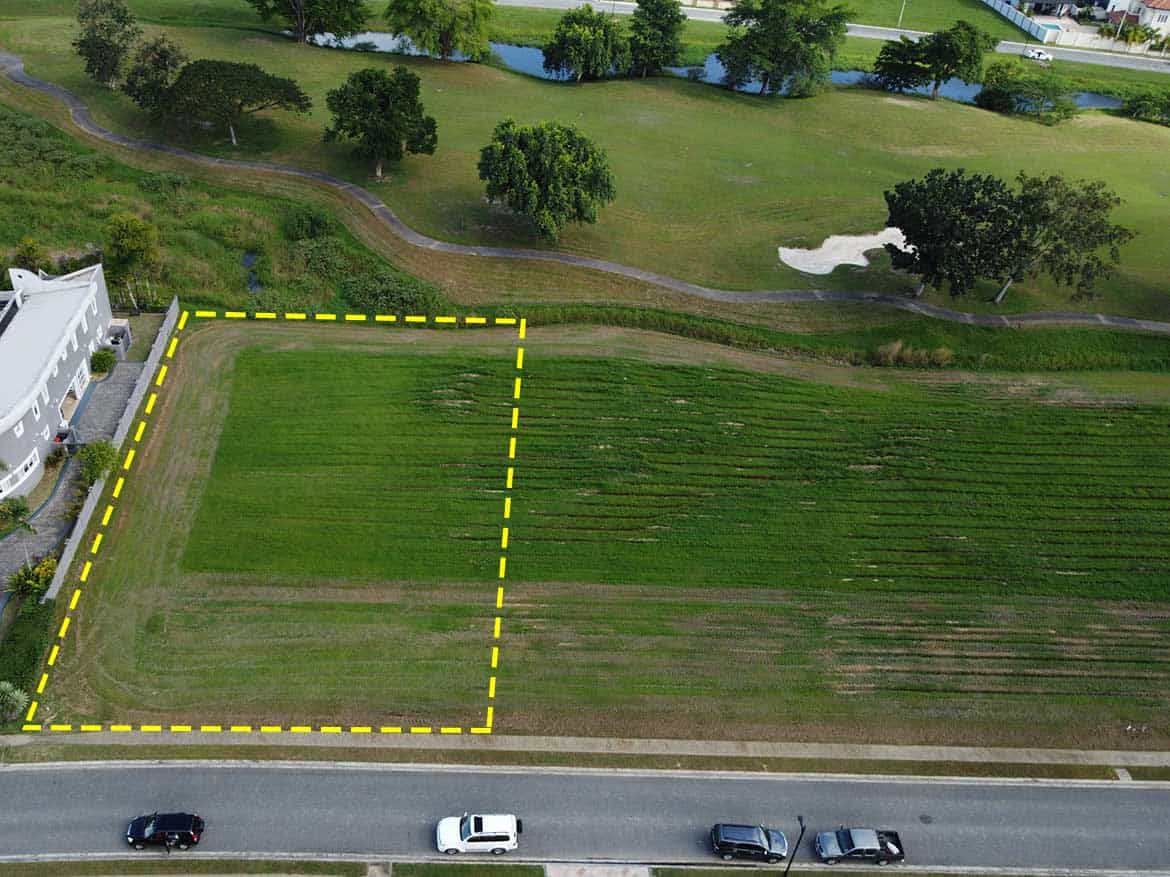 Vacant Land at Villas at Millennium Lakes Cornerstone- Empty plot of land for sale at Villas at Millennium Lakes, surrounded by greenery.