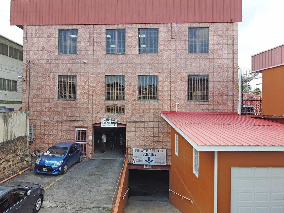 Cornerstone™ Building on St James Street Cornerstone- Multi-story brick building with parking garage entrance on St James Street.