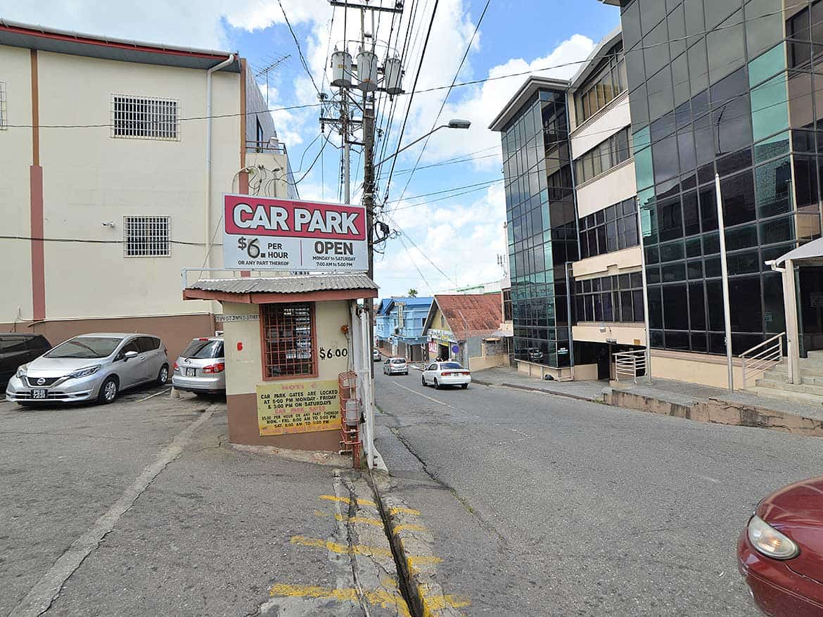 Cornerstone™ Parking Lot on St James Street Cornerstone- Parking lot with sign for Cornerstone™ on St James Street, Trinidad.