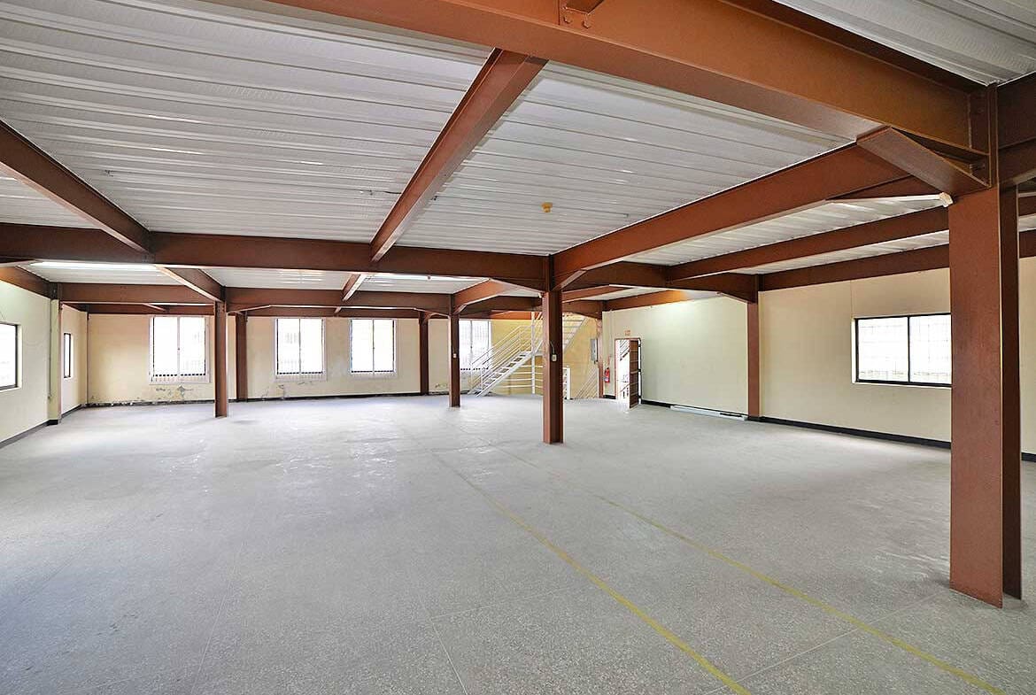 Cornerstone- Large open commercial space with steel beams and windows in St James Street.