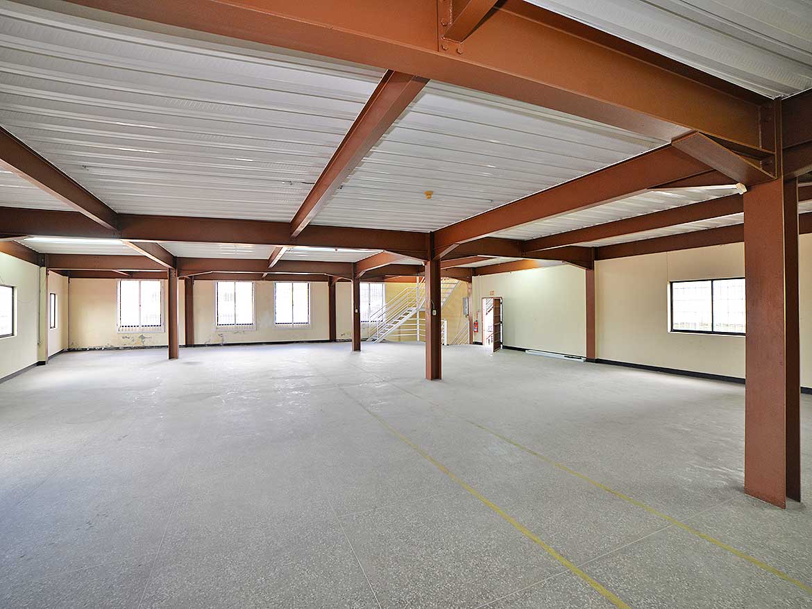 Spacious Commercial Interior at Cornerstone Cornerstone- Large open commercial space with steel beams and windows in St James Street.