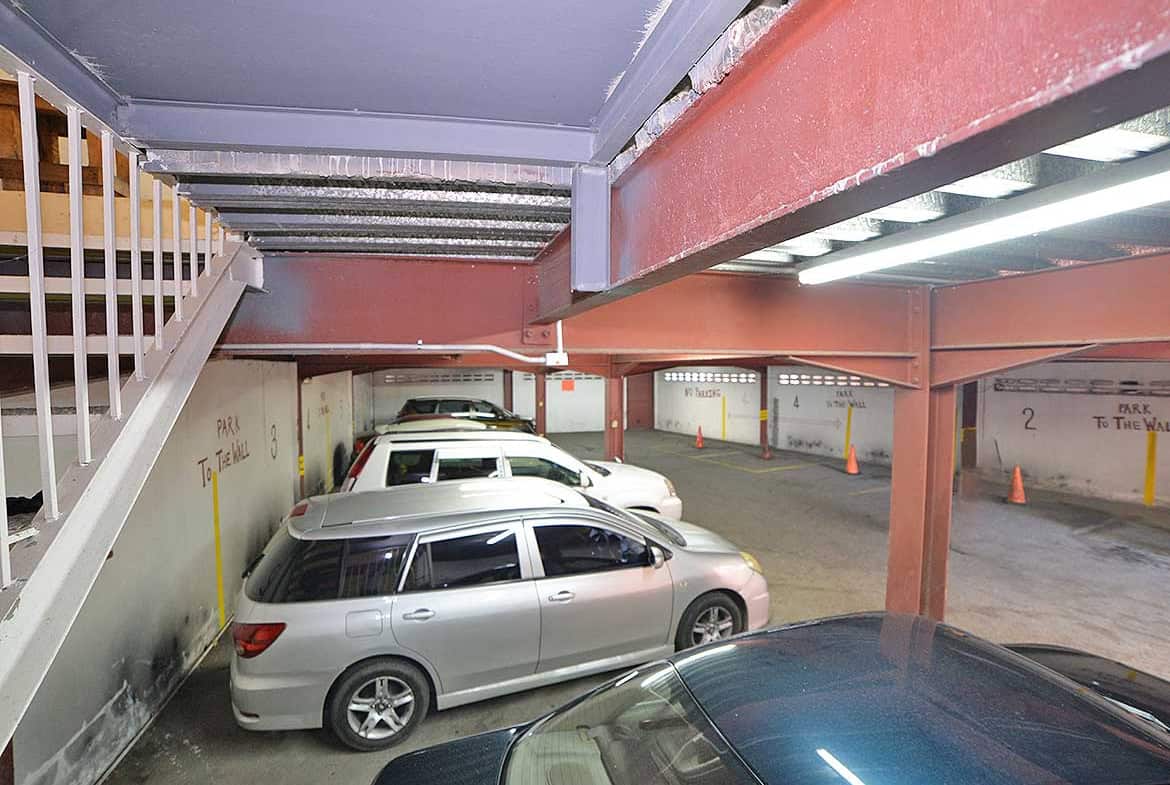 Cornerstone- Underground parking lot with parked cars at Cornerstone.