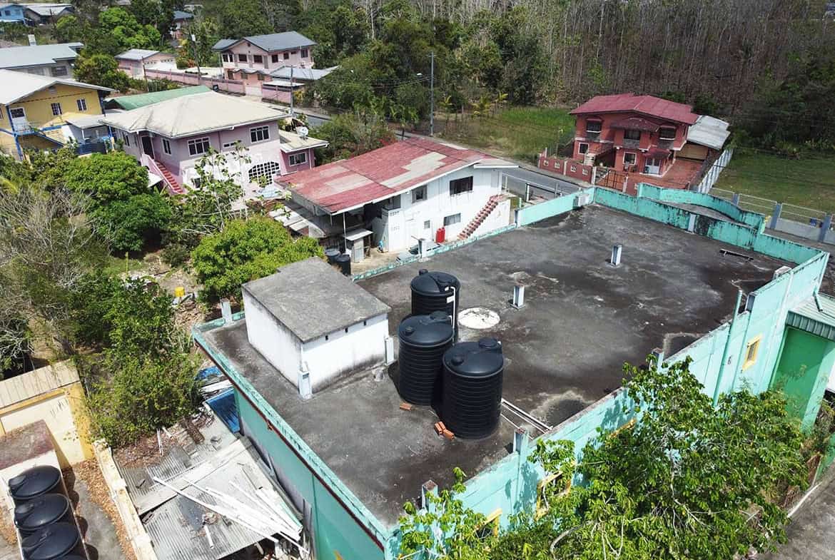 Cornerstone- Aerial view of Cornerstone™ building with water tanks on Bonne Aventure Road.