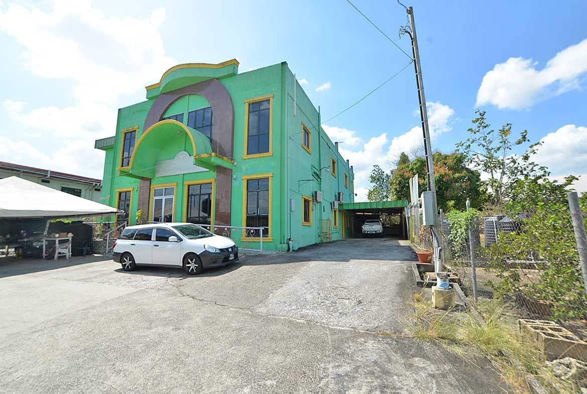 Cornerstone- Colorful Cornerstone™ building on Bonne Aventure Road with parking lot.