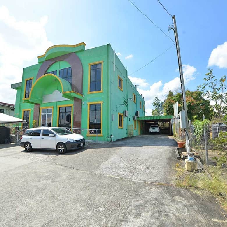 Cornerstone- Colorful Cornerstone™ building on Bonne Aventure Road with parking lot.