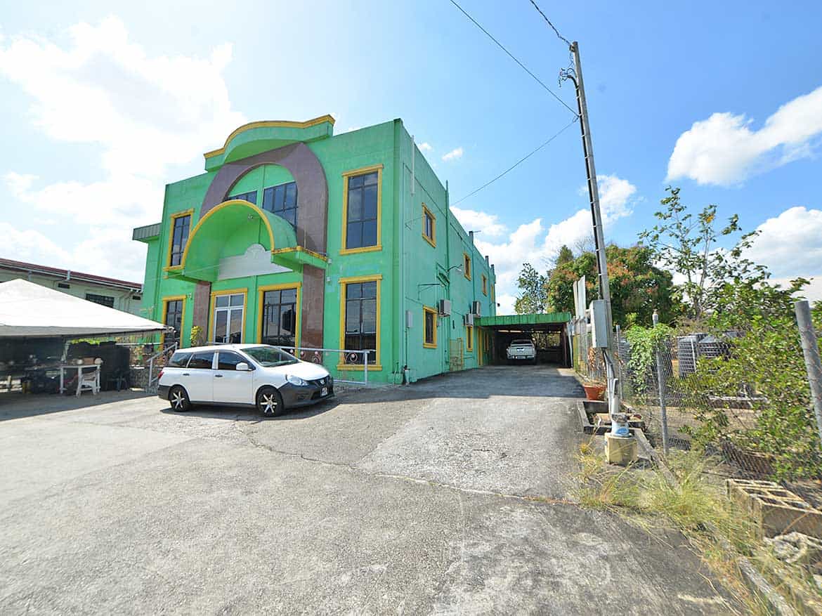 Cornerstone- Colorful Cornerstone™ building on Bonne Aventure Road with parking lot.