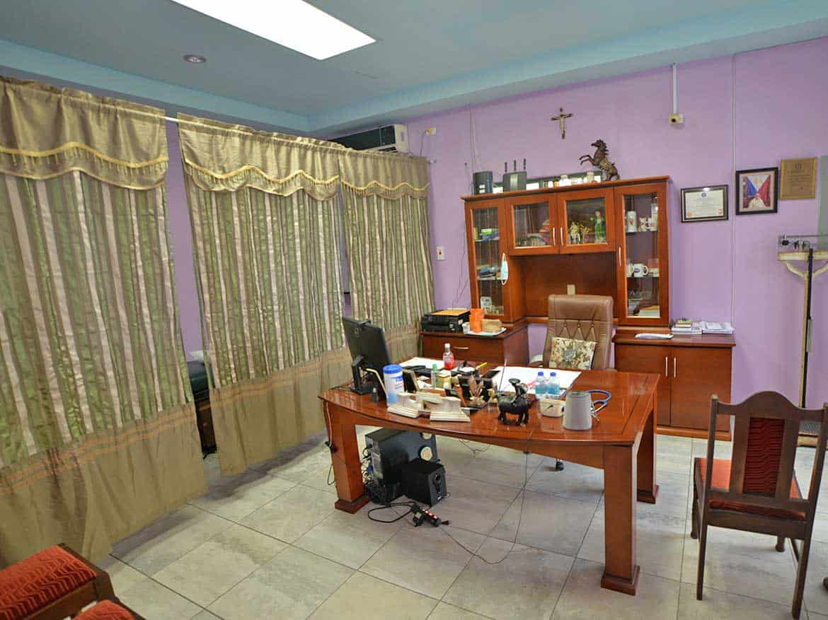 Cornerstone™ Office Interior Cornerstone- Office space with desk, chairs, and purple walls at Cornerstone™.