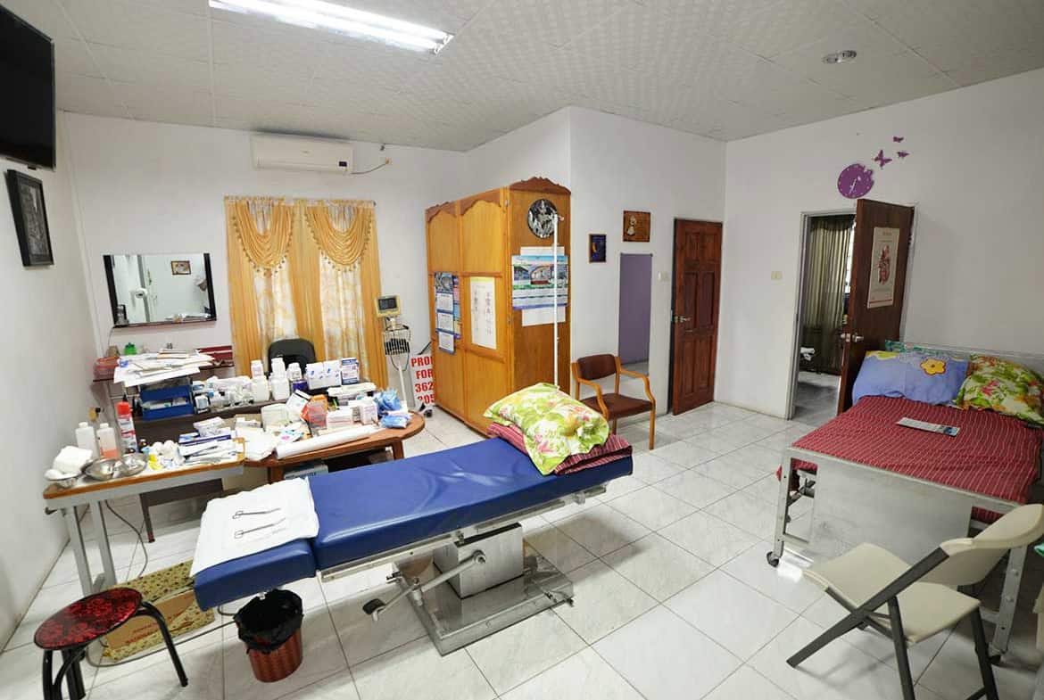 Cornerstone- Medical examination room with beds, chairs, and medical supplies at Cornerstone.
