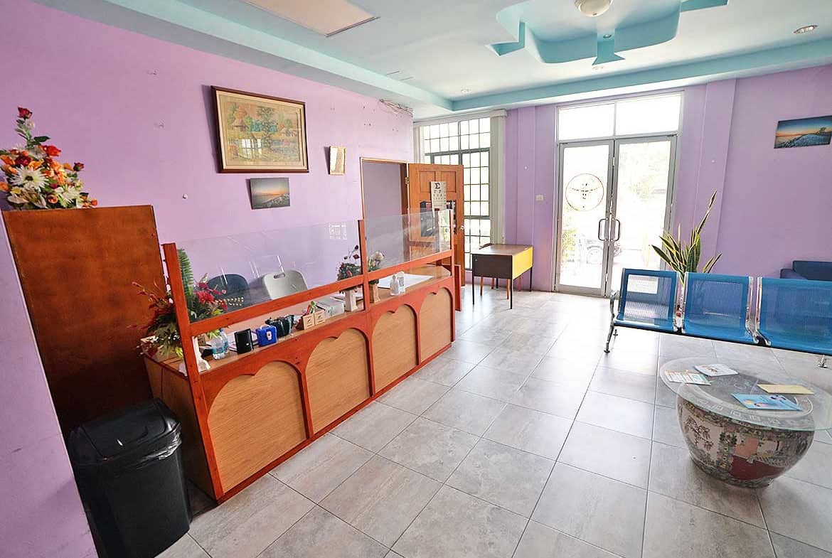 Cornerstone- Bright reception area with purple walls and glass door at Cornerstone™.