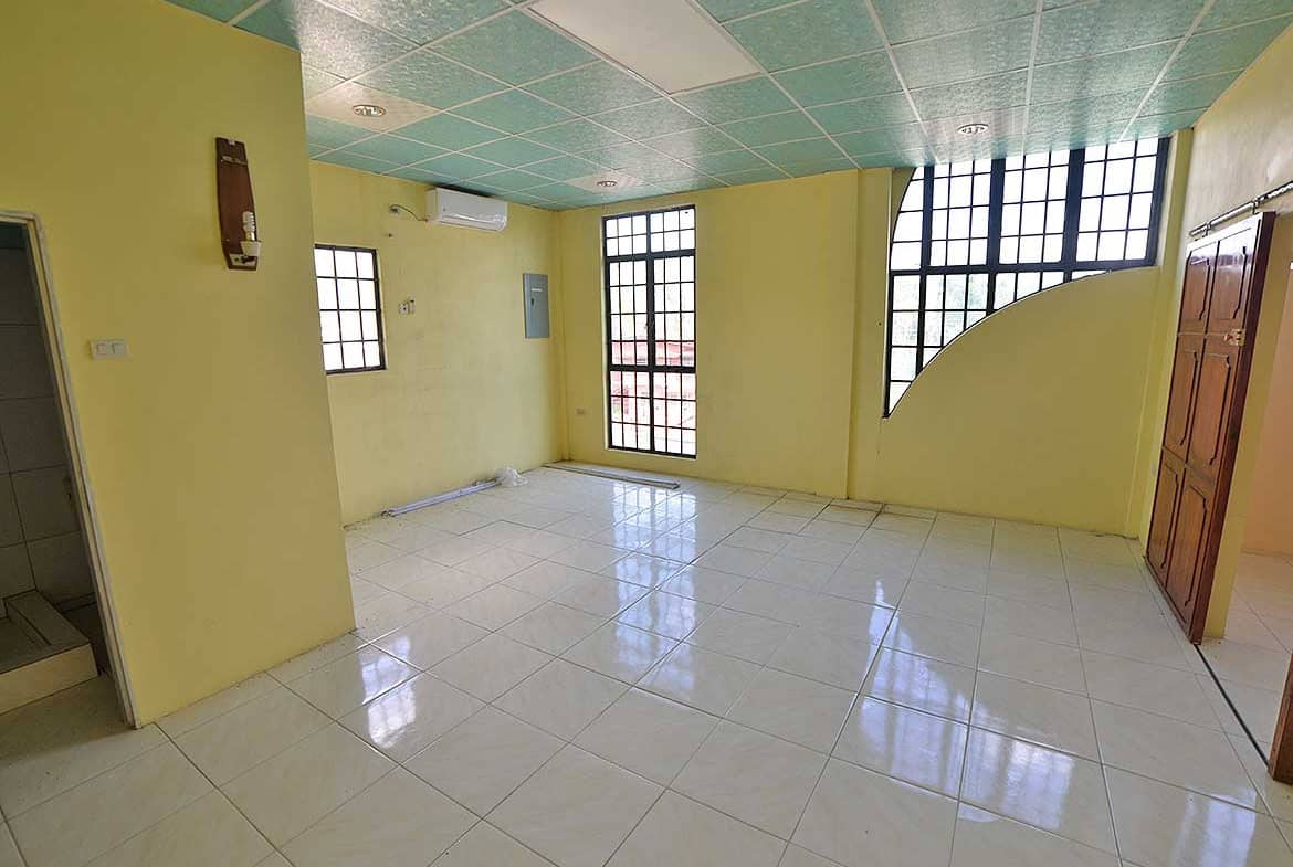 Cornerstone- Spacious room with large windows and tiled floors in Bonne Aventure Road.