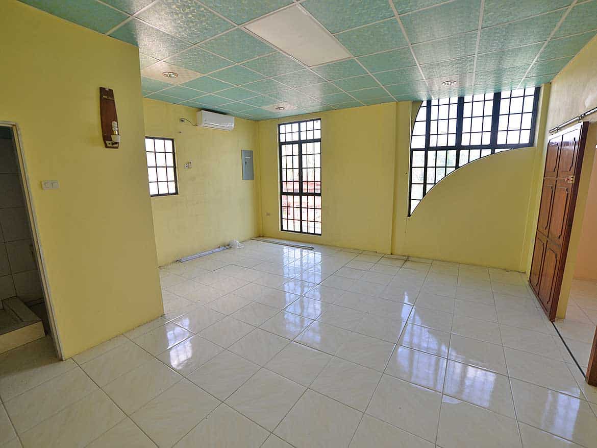 Interior of Commercial Space in Bonne Aventure Cornerstone- Spacious room with large windows and tiled floors in Bonne Aventure Road.