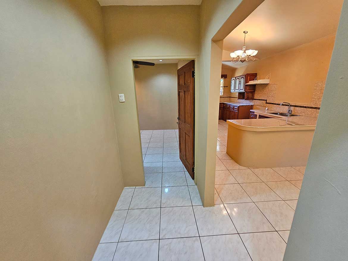 Interior View of Calcutta Road Apartment Cornerstone- Spacious hallway leading to kitchen in Calcutta Road apartment.