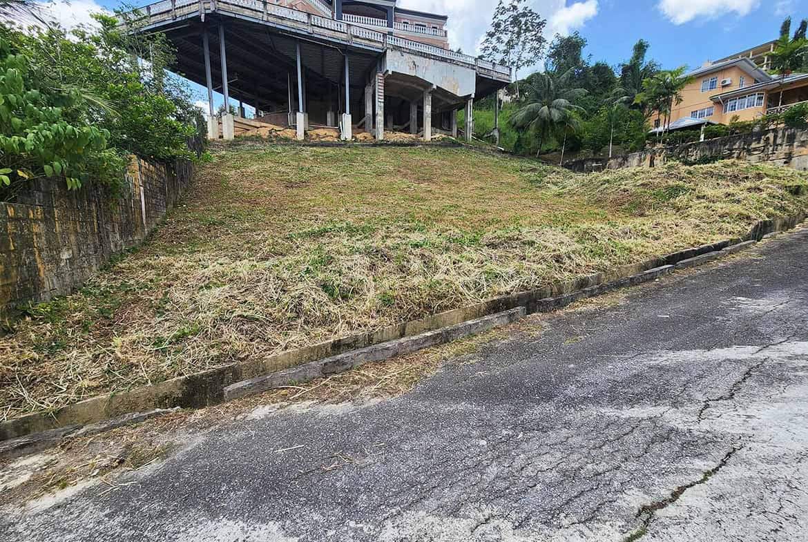 Cornerstone- Sloped residential lot with house on top in Graceland Heights.