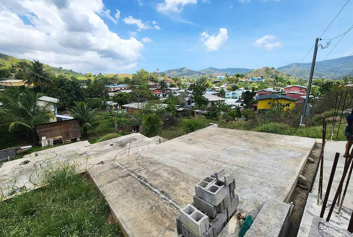 Cornerstone- Panoramic view of Graceland Heights with houses and mountains in the background.