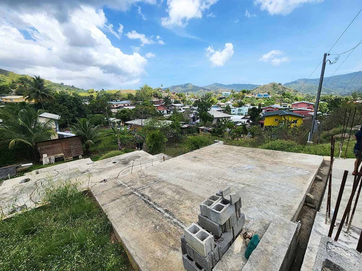 Scenic View of Graceland Heights Cornerstone- Panoramic view of Graceland Heights with houses and mountains in the background.