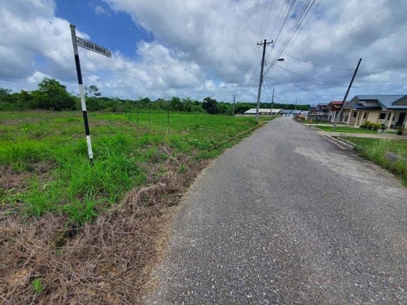 Cornerstone- Empty street in Jai Court, Brazil with houses and power lines.