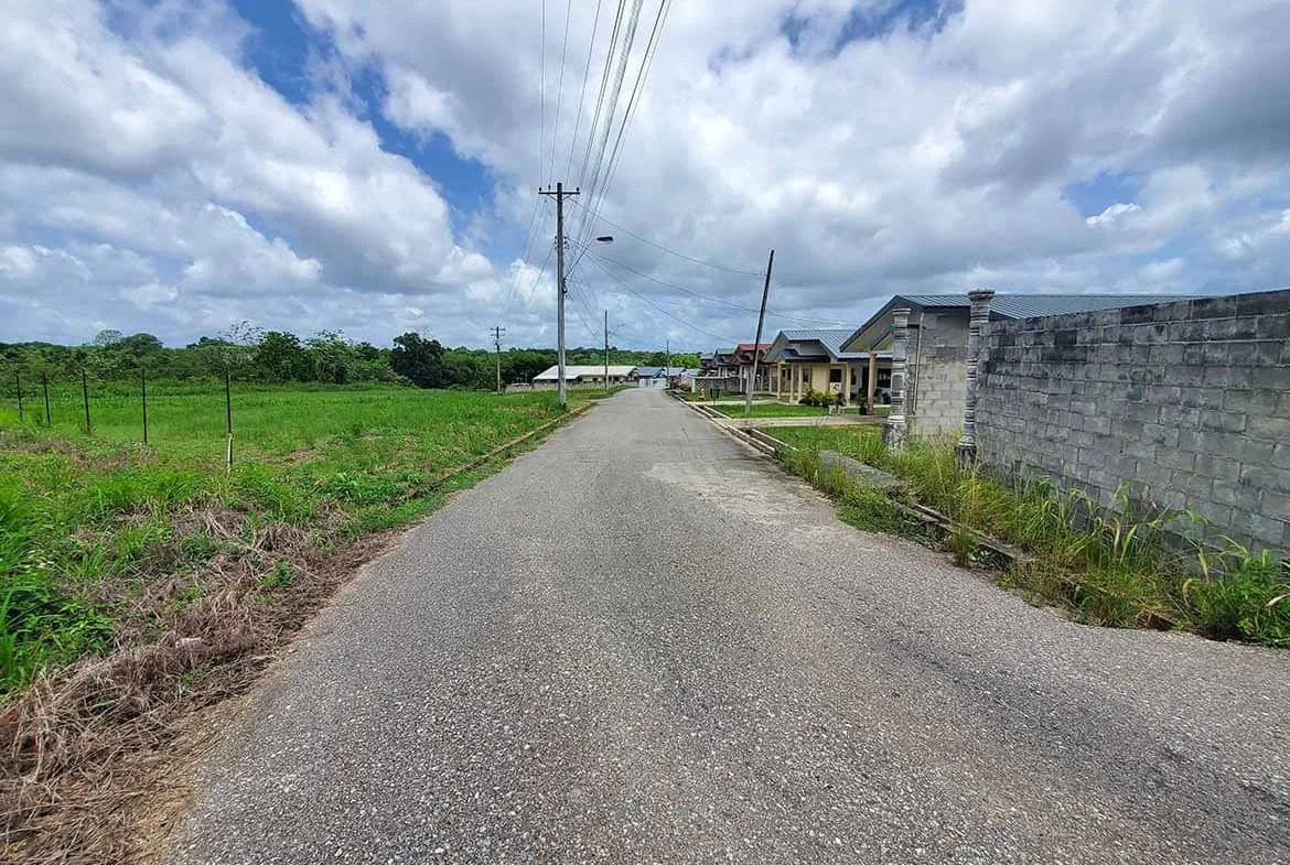 Cornerstone- Quiet rural street in Jai Court, Brazil with houses and power lines.