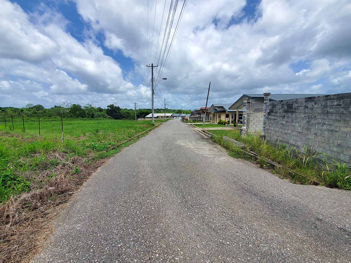 Cornerstone- Quiet rural street in Jai Court, Brazil with houses and power lines.
