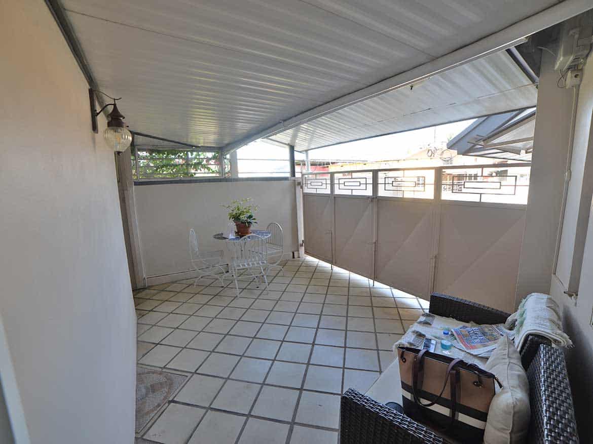 Spacious Balcony for 1-Bedroom Apt Cornerstone- Balcony with seating area and view in 1-bedroom apartment.