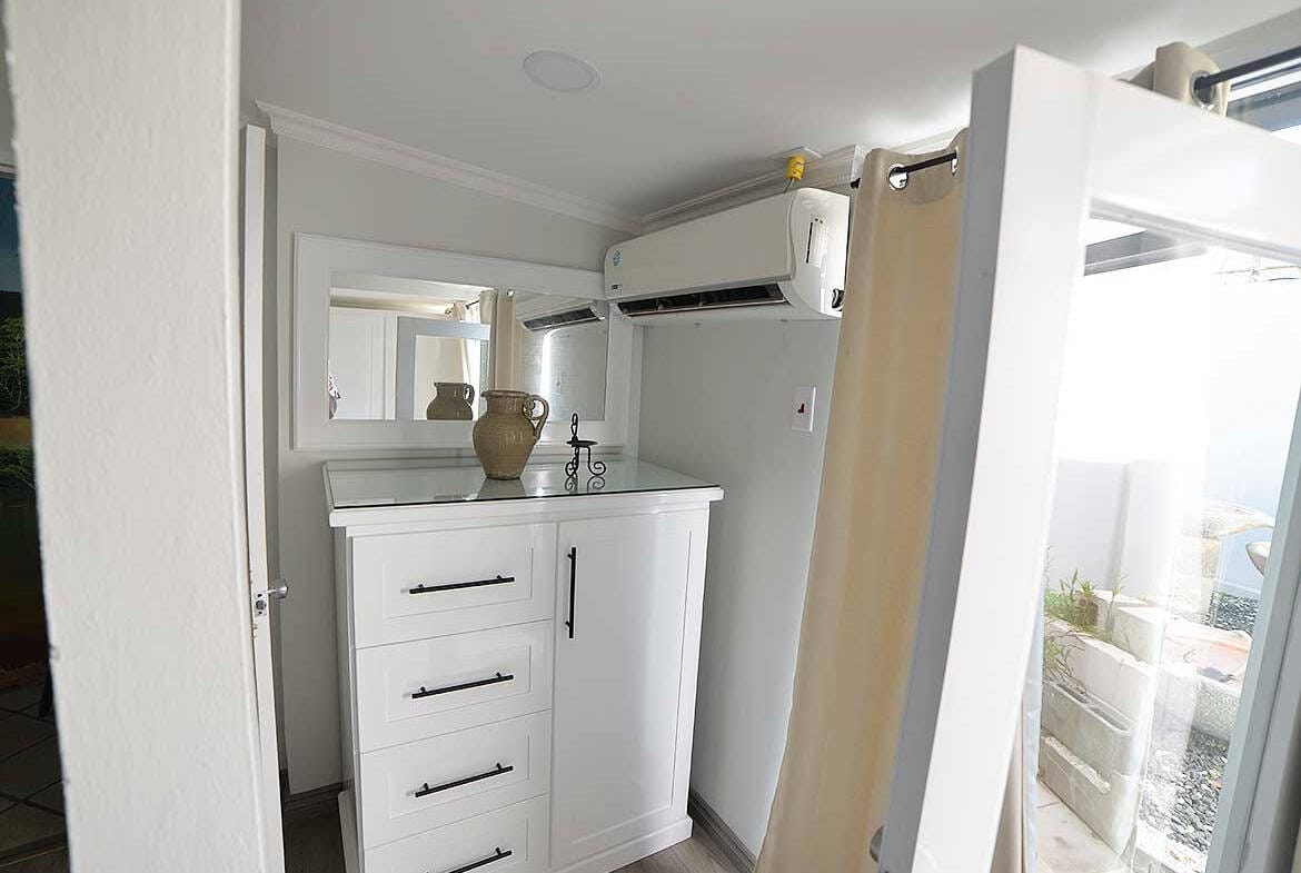 Cornerstone- Cozy 1-bedroom apartment with modern decor and balcony view.