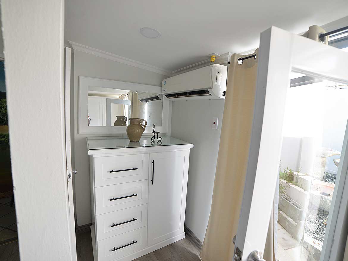 Modern 1-Bedroom Apartment Interior Cornerstone- Cozy 1-bedroom apartment with modern decor and balcony view.