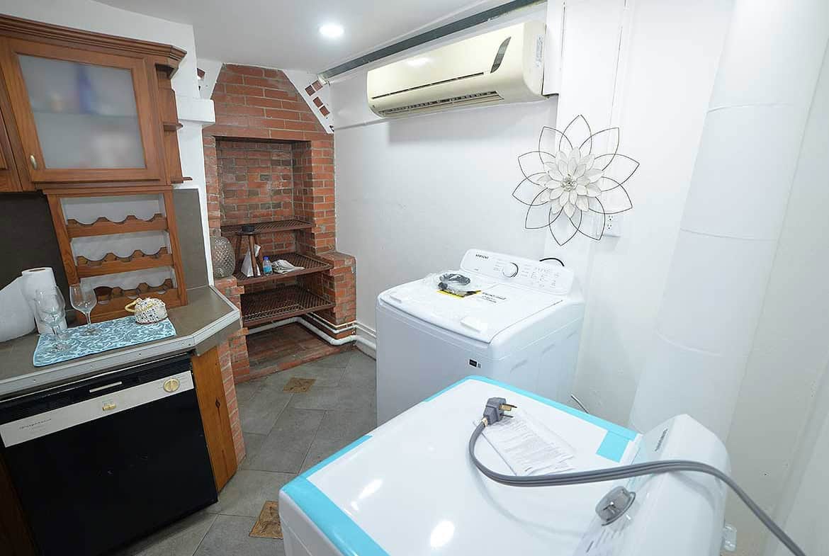 Cornerstone- Compact laundry space with washing machine and dryer in Cornerstone™ apartment.