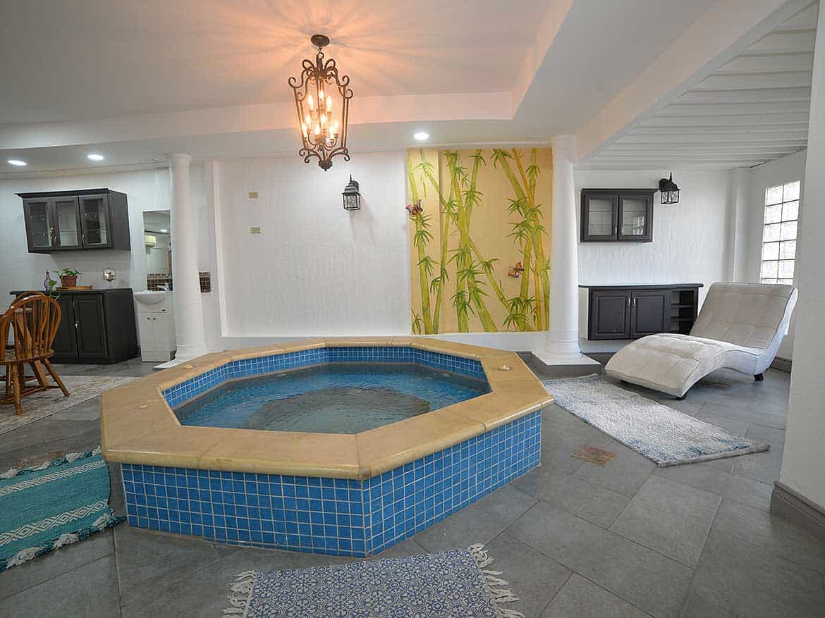 Indoor Pool Area at Cornerstone Cornerstone- Indoor pool with blue tiles and relaxing lounge area at Cornerstone.