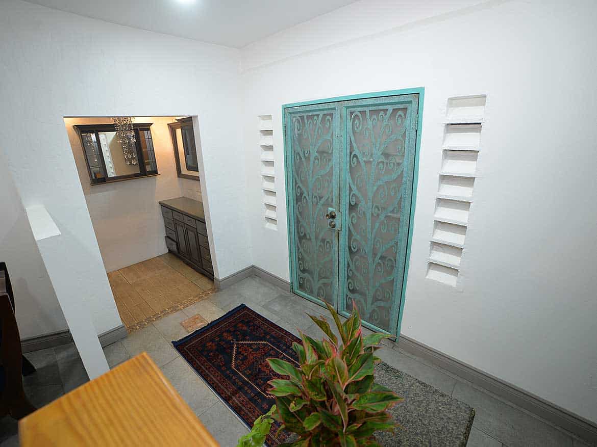 Cornerstone™ 1-Bedroom Apartment Entrance Cornerstone- Entrance to a 1-bedroom apartment with decorative teal door at Cornerstone™.