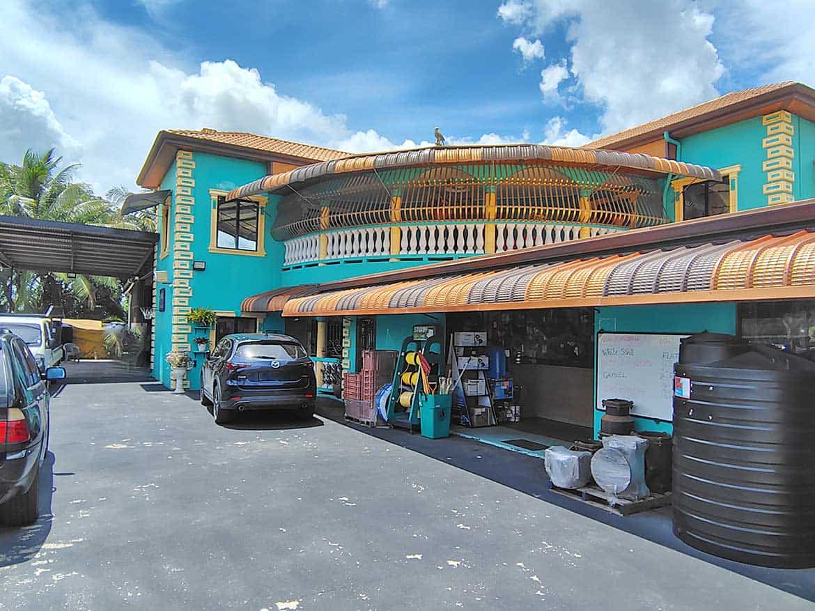 Cornerstone™ Residence with Retail Space Cornerstone- Colorful building with retail space and parking lot in front.