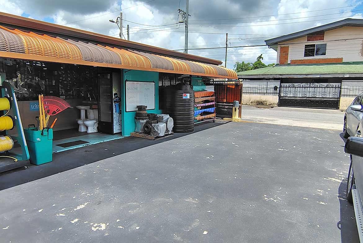 Cornerstone- Exterior view of Cornerstone™ retail space with parking lot and equipment.