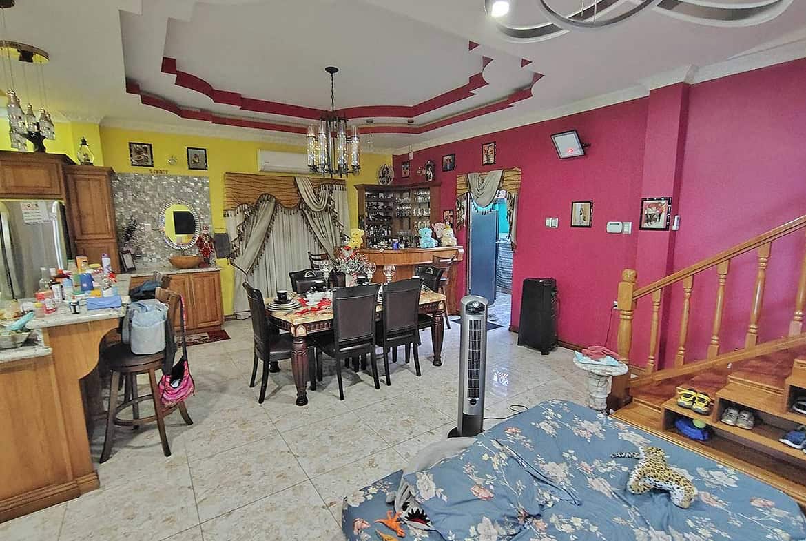 Cornerstone- Interior of a colorful living and dining room with furniture and decor.