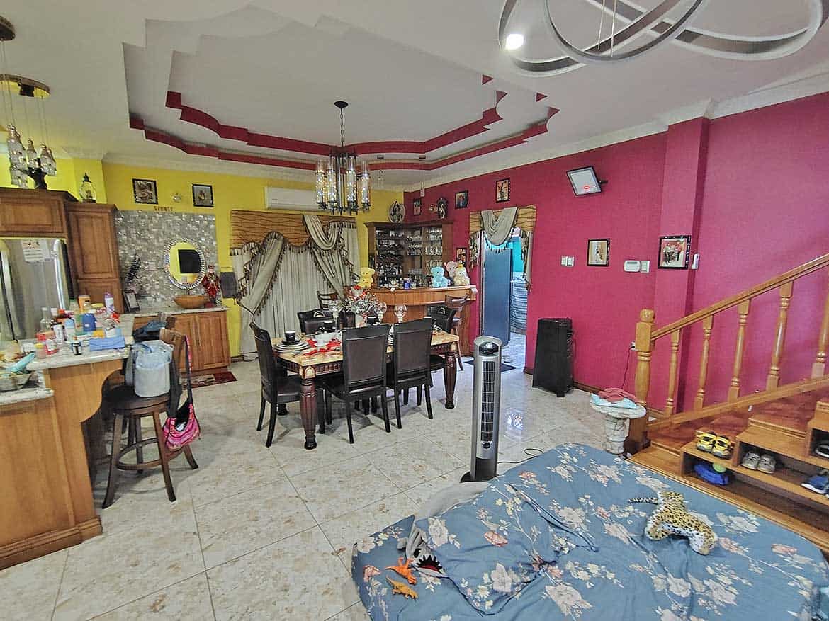 Spacious Living Area with Dining Space Cornerstone- Interior of a colorful living and dining room with furniture and decor.