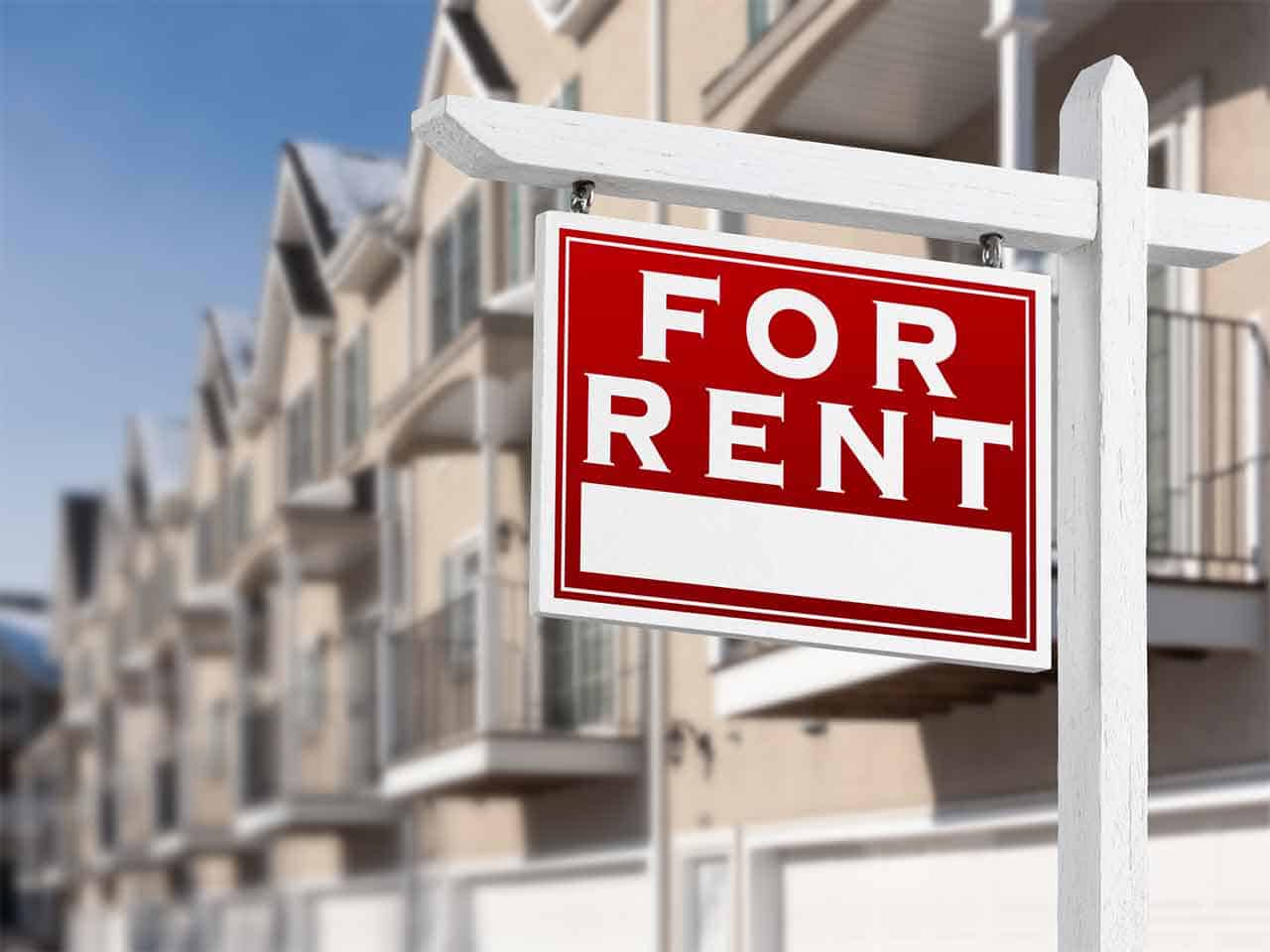 Cornerstone- For rent sign in front of modern apartment complex.