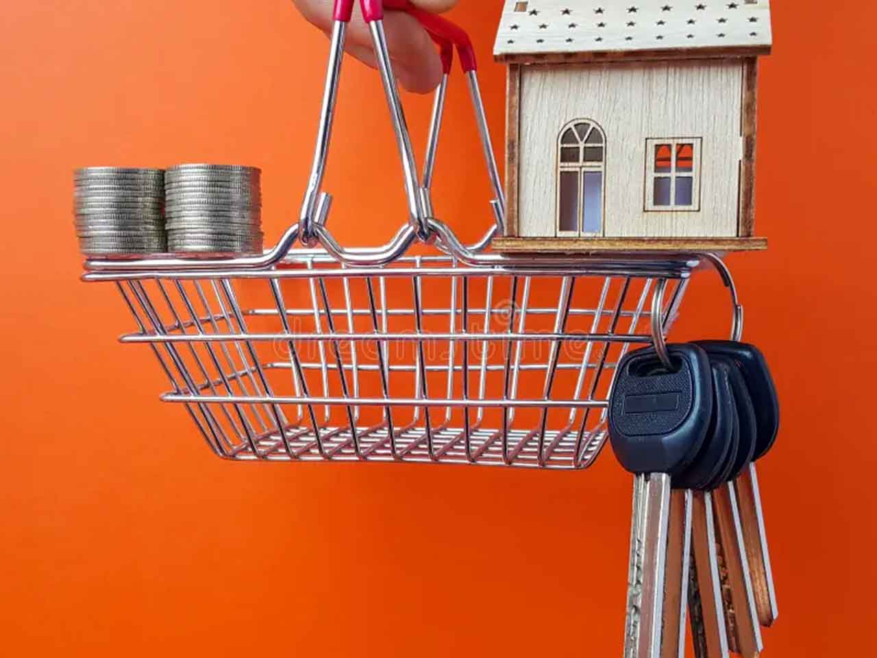Cornerstone- Miniature house on shopping cart with coins and keys.