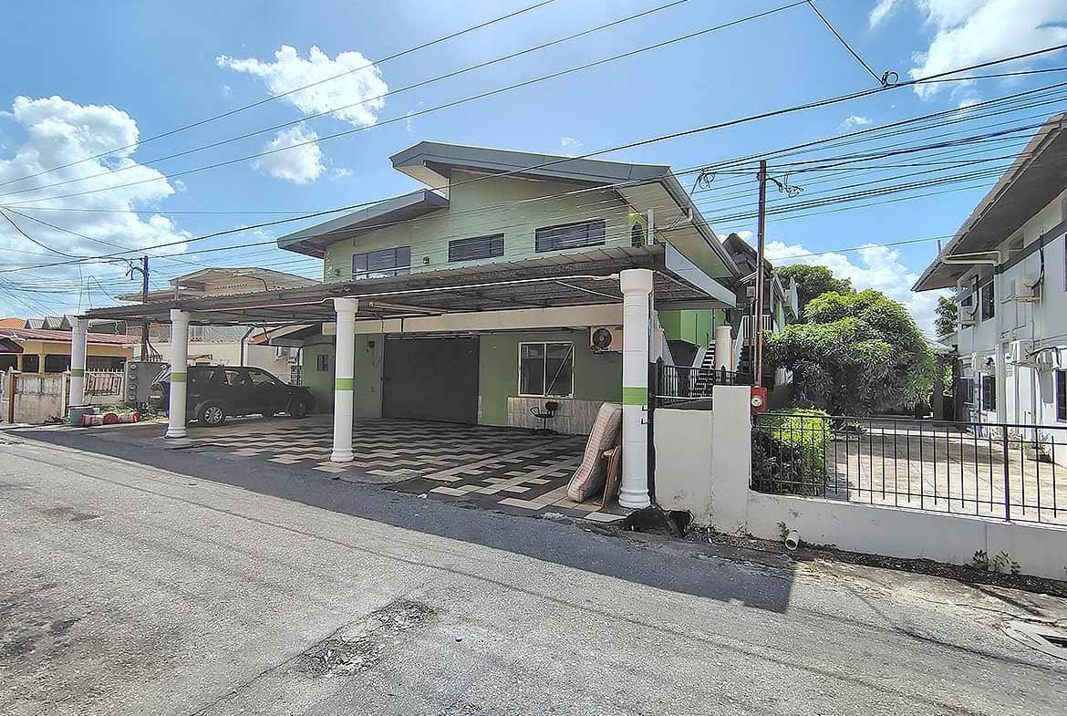 Cornerstone- Residential building at Ganga Terrace, El Socorro with carport and greenery.