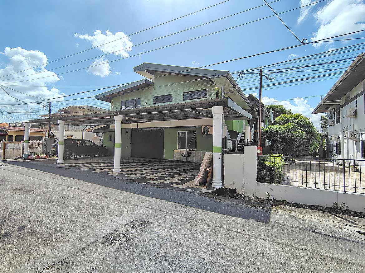 Cornerstone- Residential building at Ganga Terrace, El Socorro with carport and greenery.