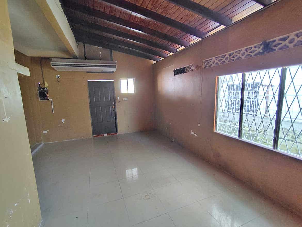 Interior of Ganga Terrace, El Socorro Cornerstone- Spacious room with large windows and wooden ceiling at Ganga Terrace, El Socorro.
