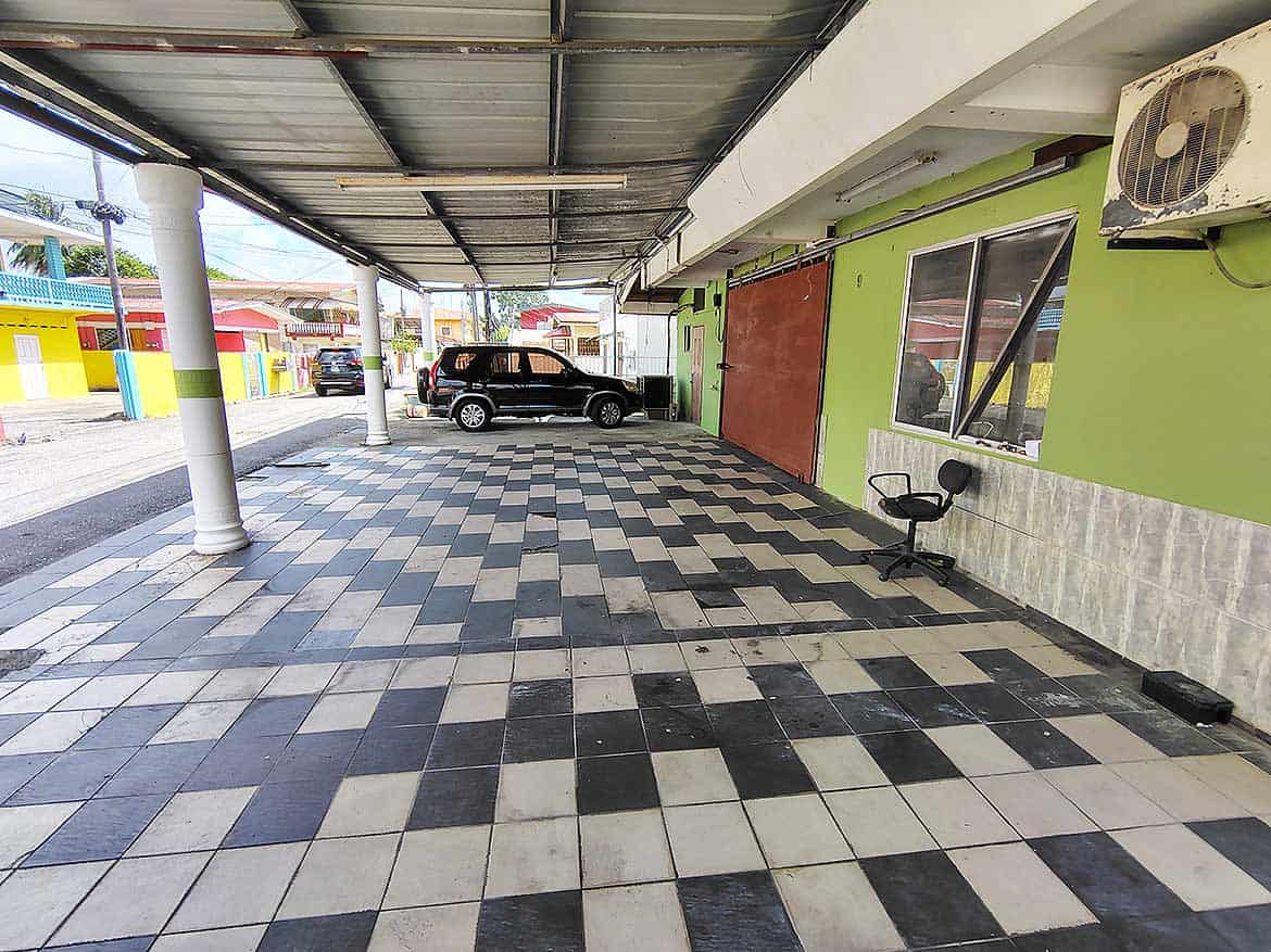 Cornerstone™ Ganga Terrace El Socorro Cornerstone- Covered parking area at Ganga Terrace, El Socorro with colorful buildings nearby.