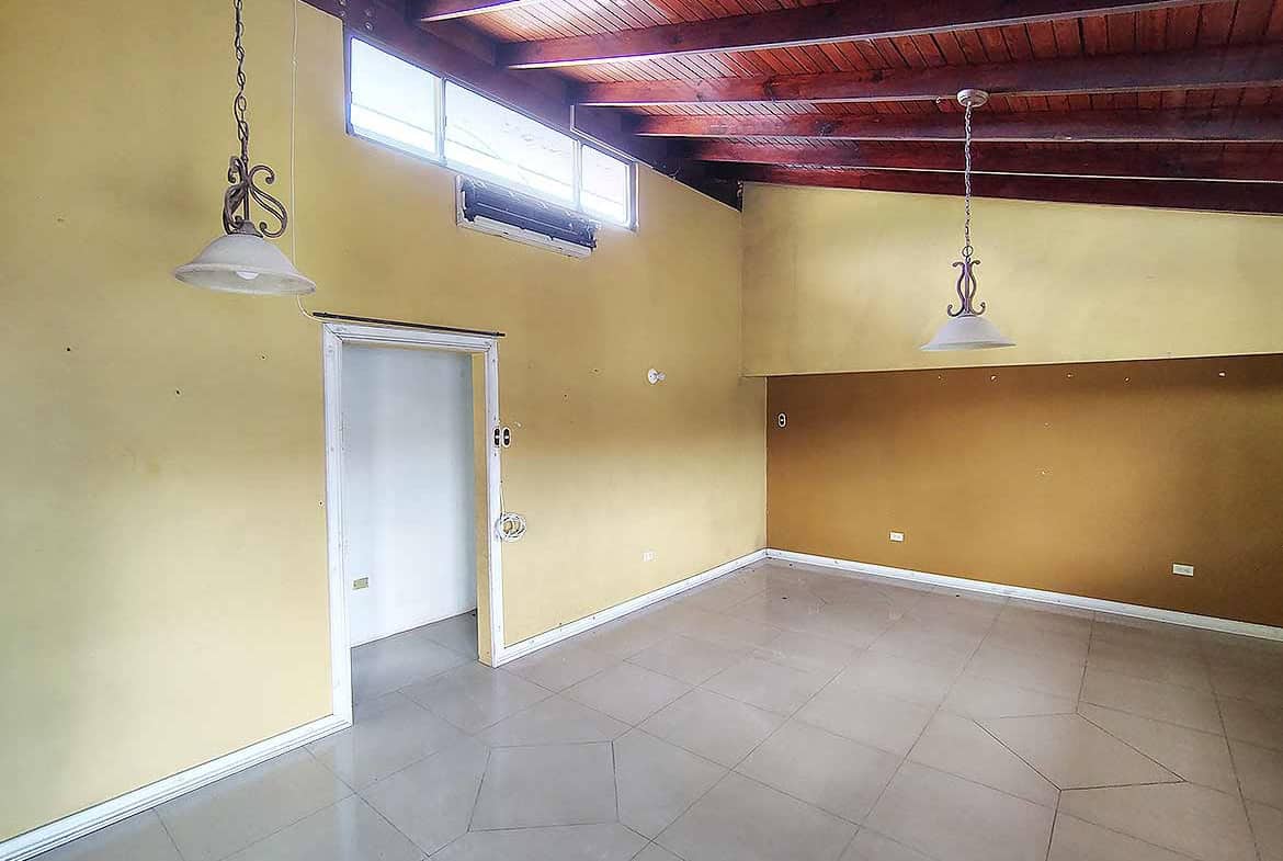 Cornerstone- Bright, empty room with wooden ceiling and large windows in Ganga Terrace.