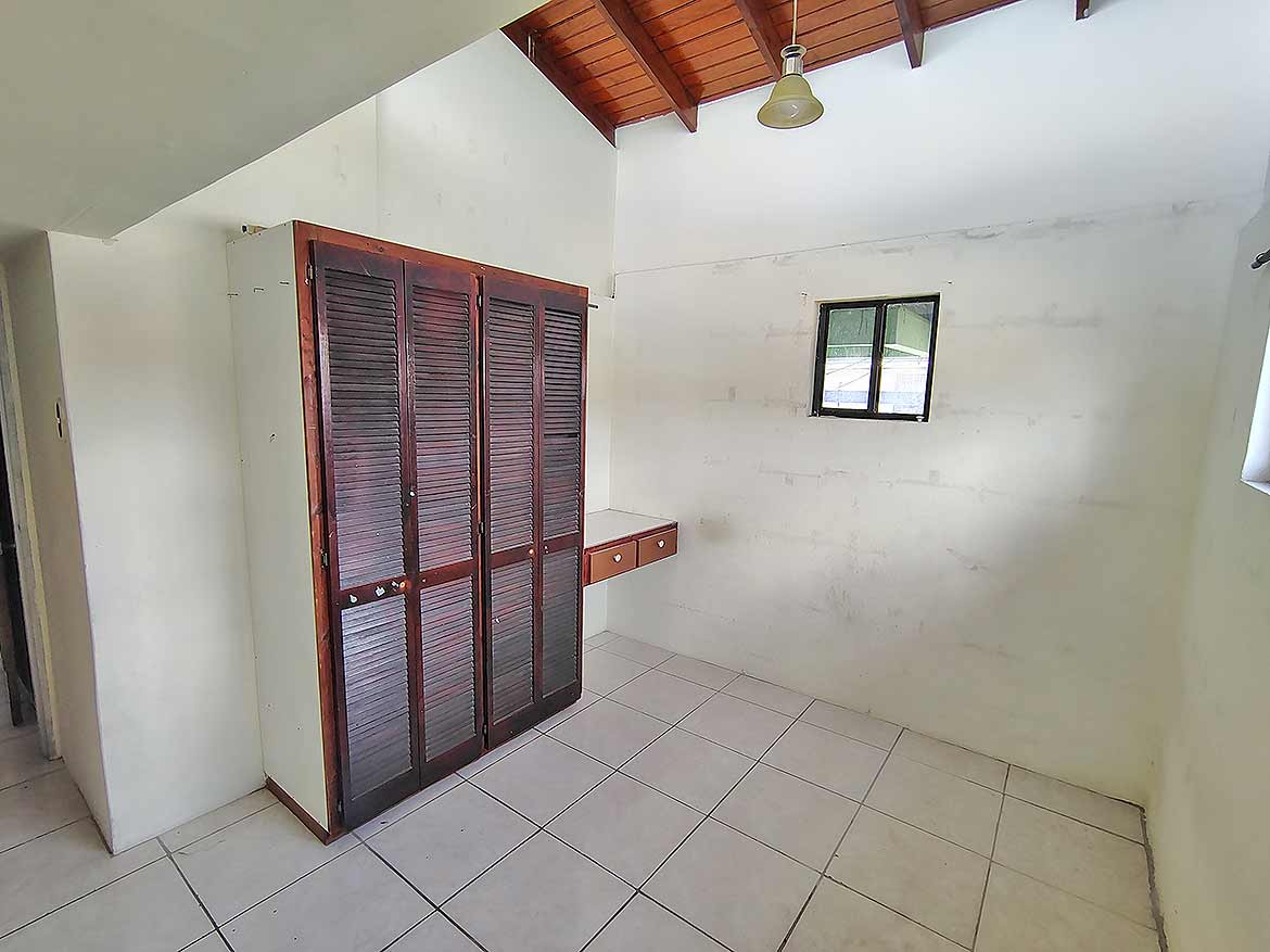 Cornerstone™ Ganga Terrace Room Cornerstone- Empty room with wooden closet and small window in Ganga Terrace.