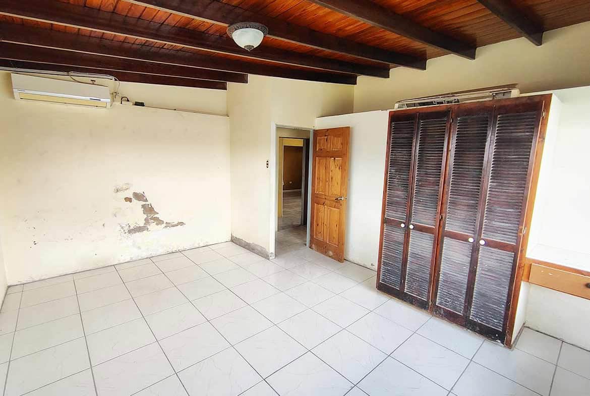 Cornerstone- Empty room with wooden ceiling and closet at Ganga Terrace, El Socorro.