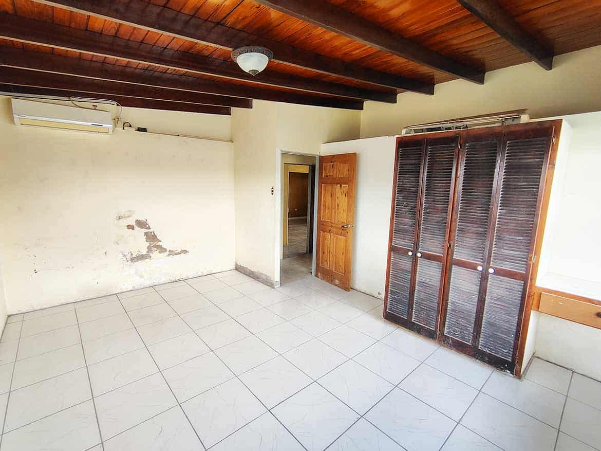 Spacious Room at Ganga Terrace Cornerstone- Empty room with wooden ceiling and closet at Ganga Terrace, El Socorro.