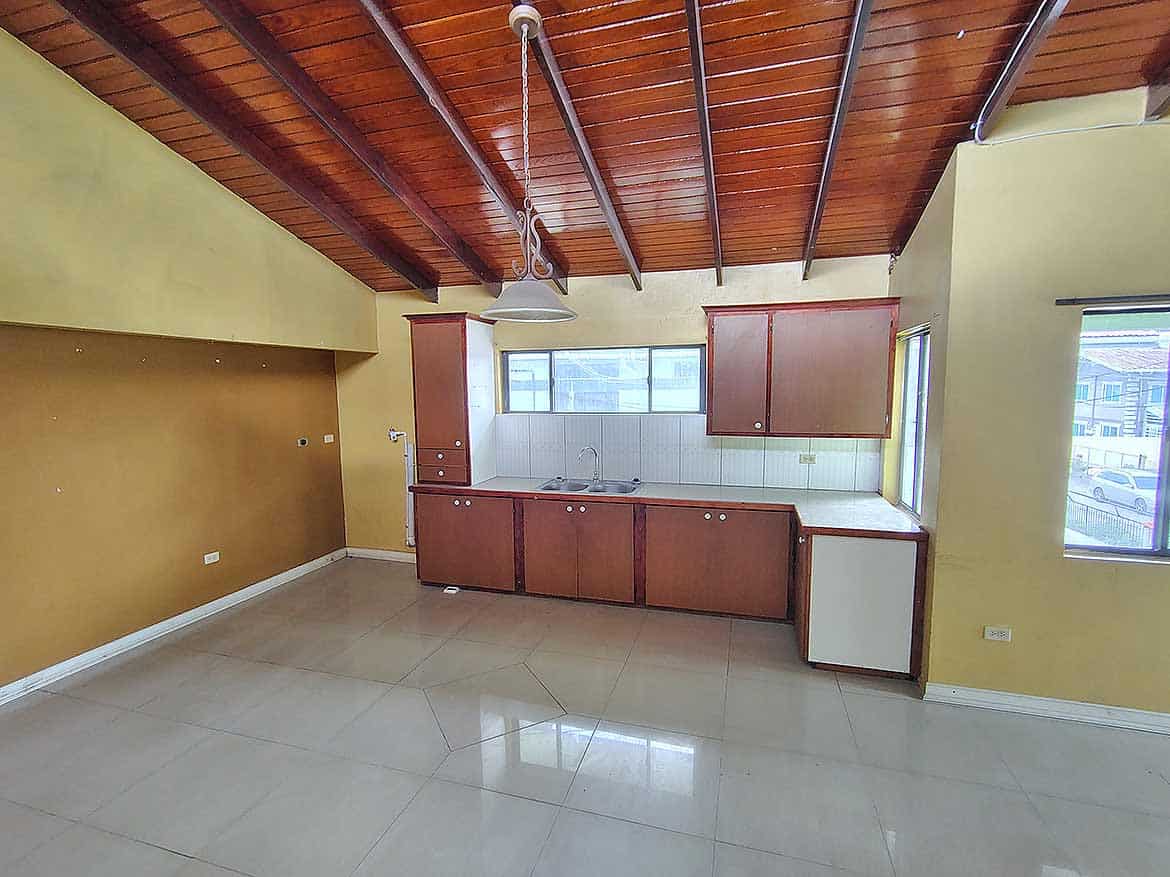 Spacious Kitchen at Ganga Terrace Cornerstone- Bright kitchen with wooden ceiling and large windows at Ganga Terrace.