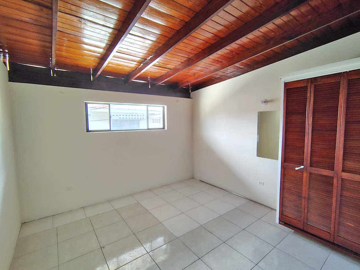 Cornerstone™ Ganga Terrace El Socorro Cornerstone- Spacious room with wooden ceiling and closet in Ganga Terrace, El Socorro.