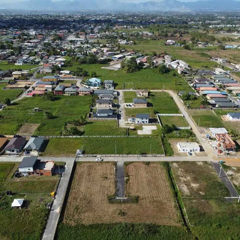 Cornerstone- Aerial view of Longdenville residential neighborhood with houses and open fields.